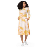 Charming long-sleeve tie-dye midi dress in yellow and white, featuring pockets and a flared hem for a stylish look.